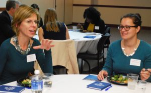 Maureen Meyer (BUS ’90) provides career advice at a Dinner on DePaul event for finance students.