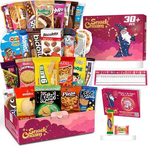An image of a box of Snack Chasm brand international snacks. 30 some snacks from around the world fan out from the box into a colorful display.