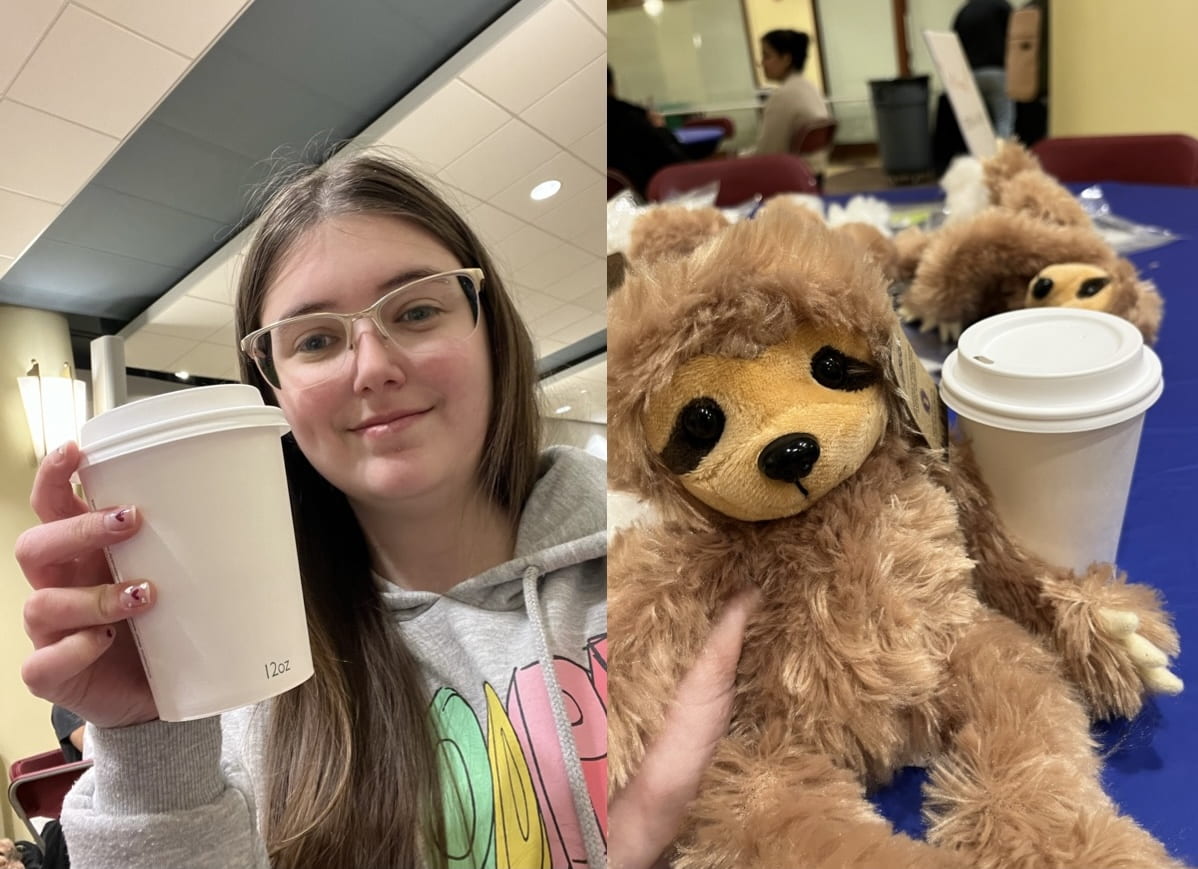 Sienna a college student holding up a drink smiling, with a stuffed sloth sitting next to another cup on a blue tablecloth.