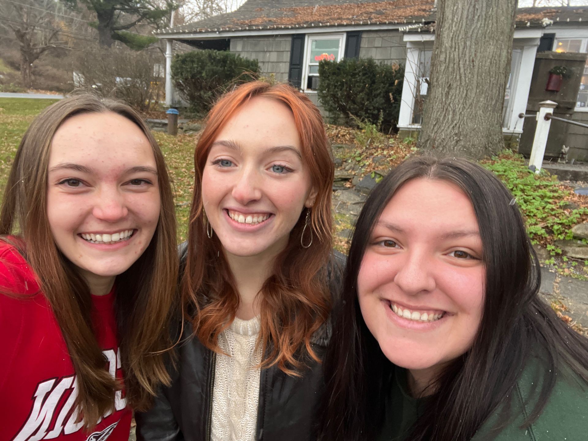 DePaul Student smiling in photo with two hometown friends over spring break