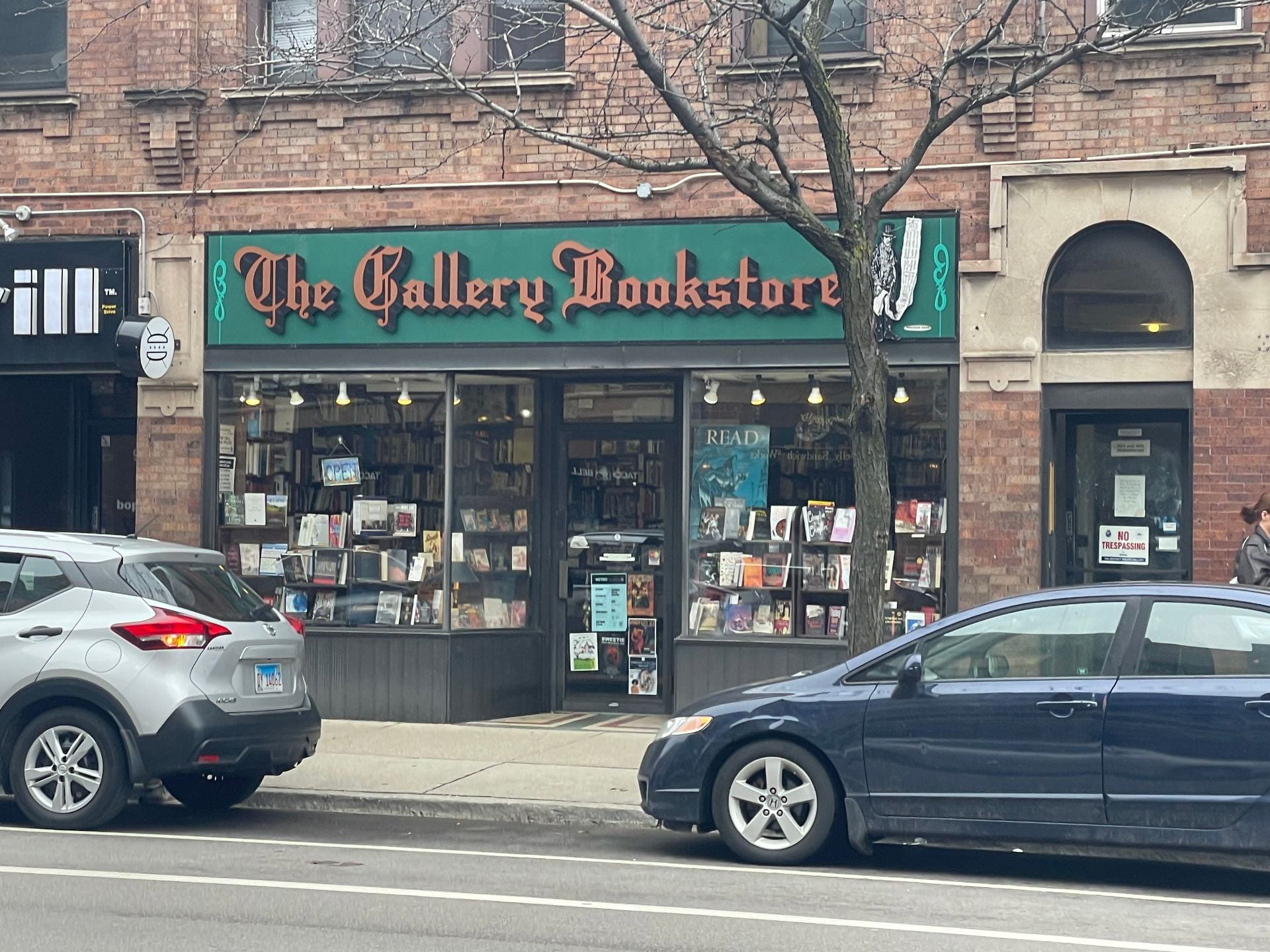 A photo showing the storefront of The Gallery Bookstore, a new and used book shop on Belmont Ave. in Chicago.